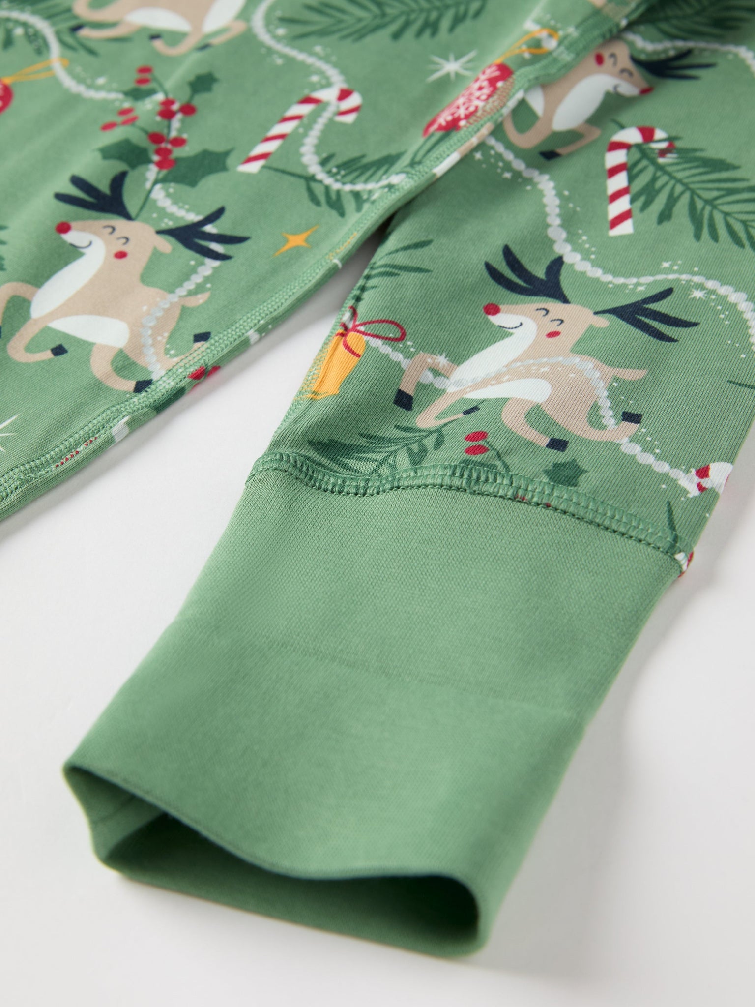 Reindeer Print Kids Pyjamas from the Polarn O. Pyret kidswear collection. Clothes made using sustainably sourced materials.