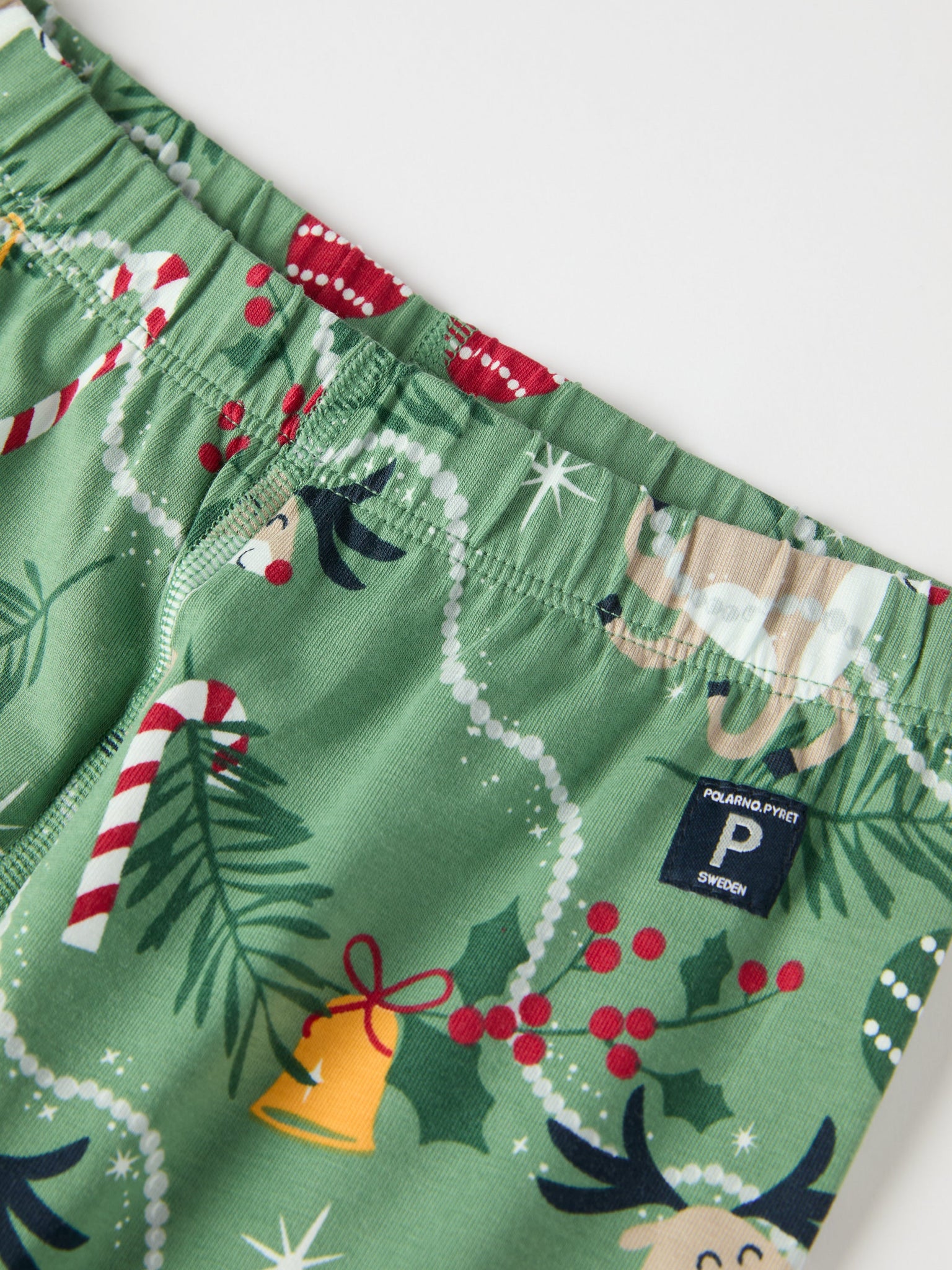 Reindeer Print Kids Pyjamas from the Polarn O. Pyret kidswear collection. Clothes made using sustainably sourced materials.