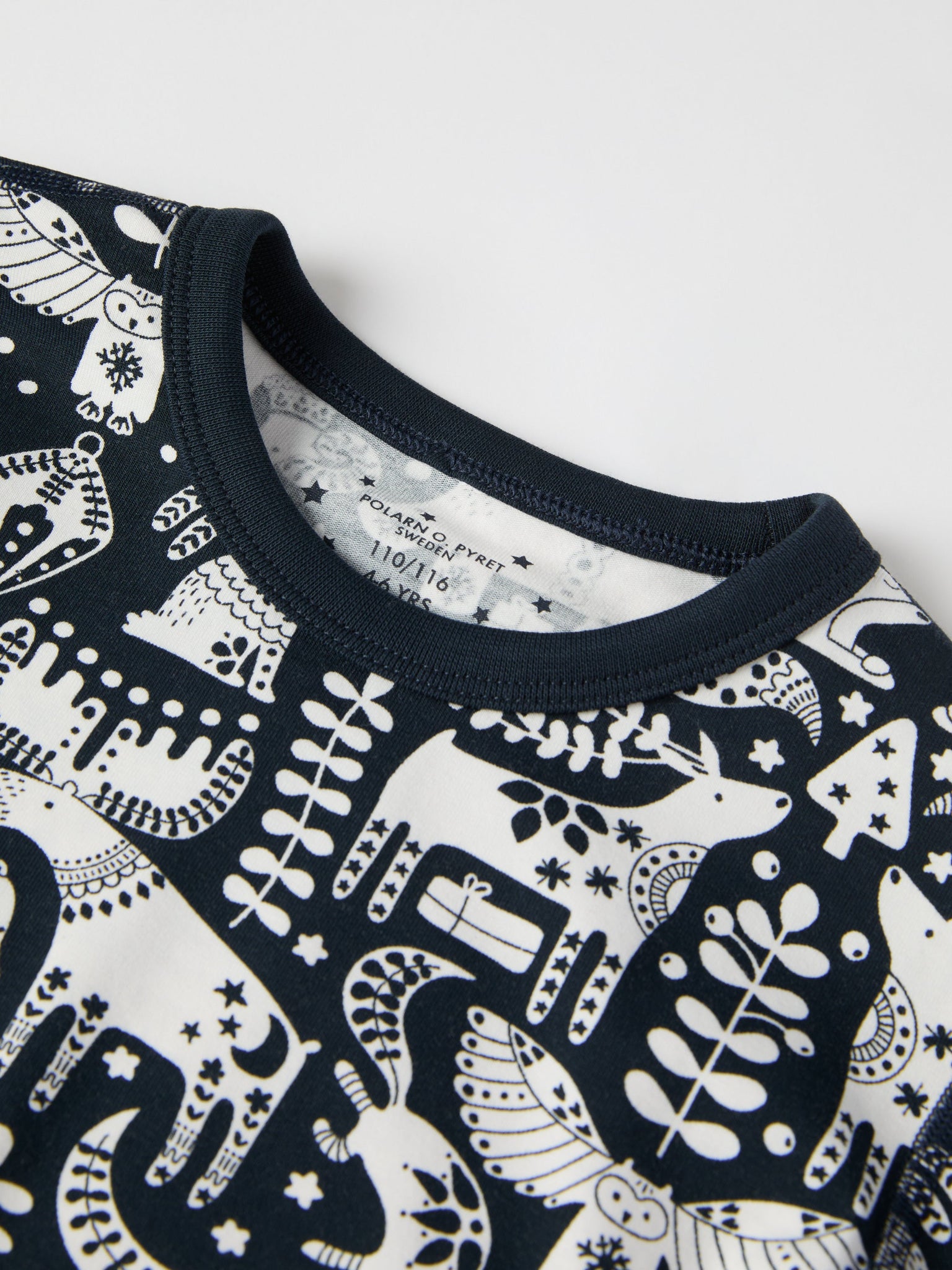 Nordic Christmas Print Kids Pyjamas from the Polarn O. Pyret kidswear collection. Ethically produced kids clothing.