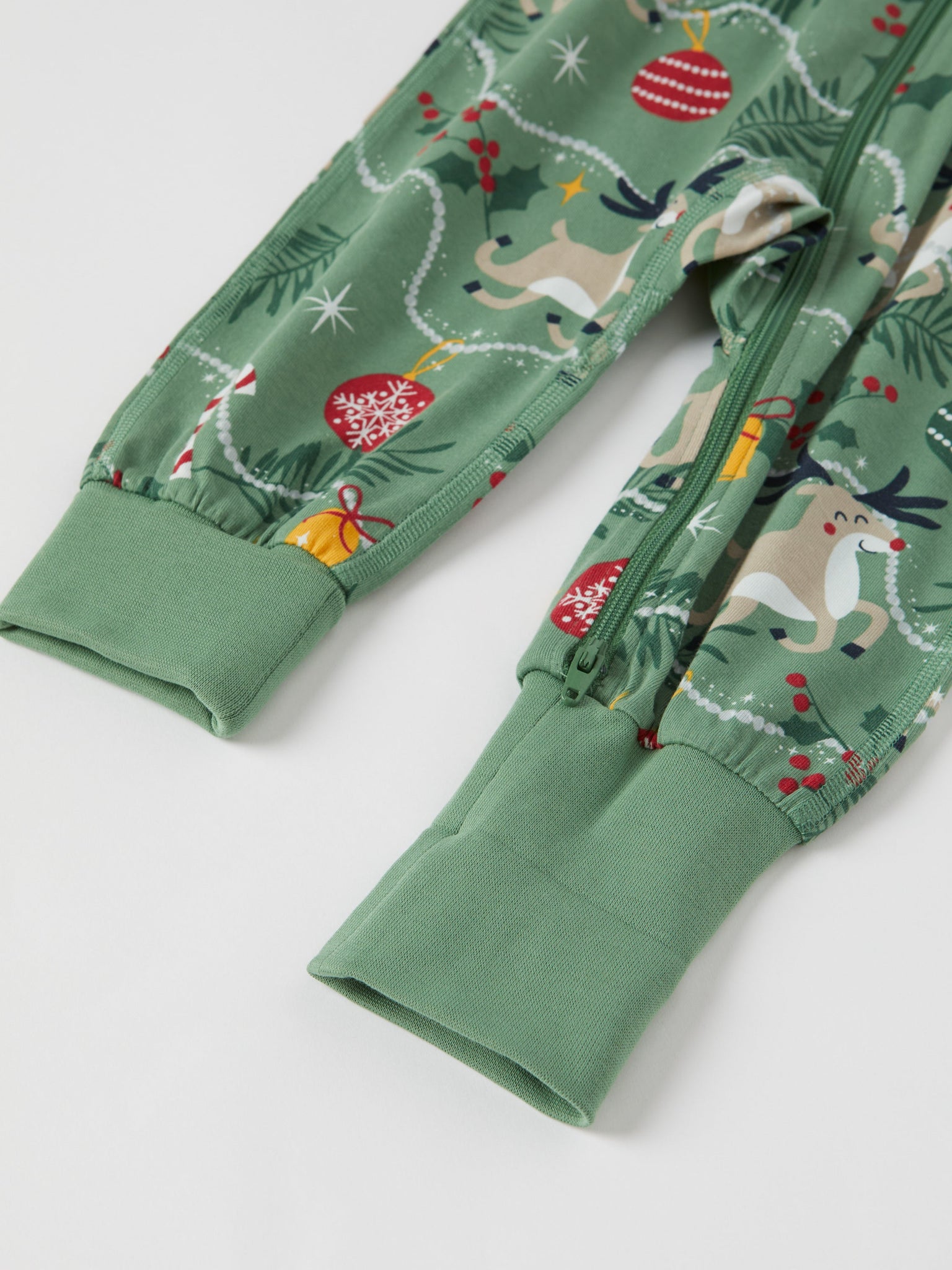 Reindeer Print Baby Sleepsuit from the Polarn O. Pyret baby collection. Nordic kids clothes made from sustainable sources.