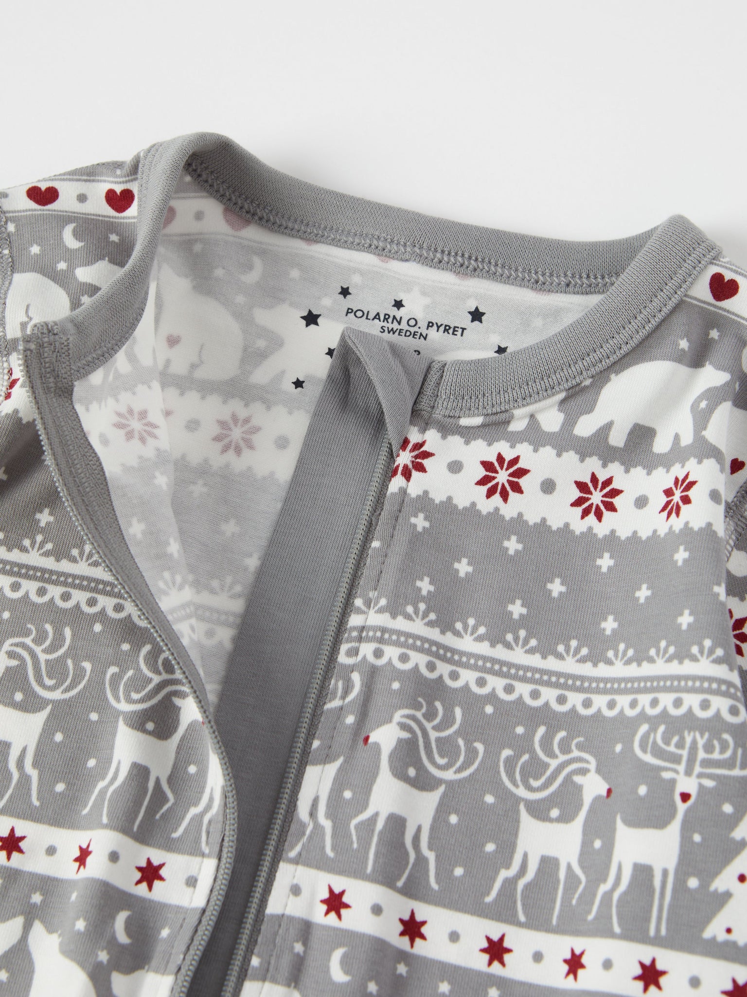 Nordic Christmas Print Baby Sleepsuit from the Polarn O. Pyret baby collection. Ethically produced kids clothing.