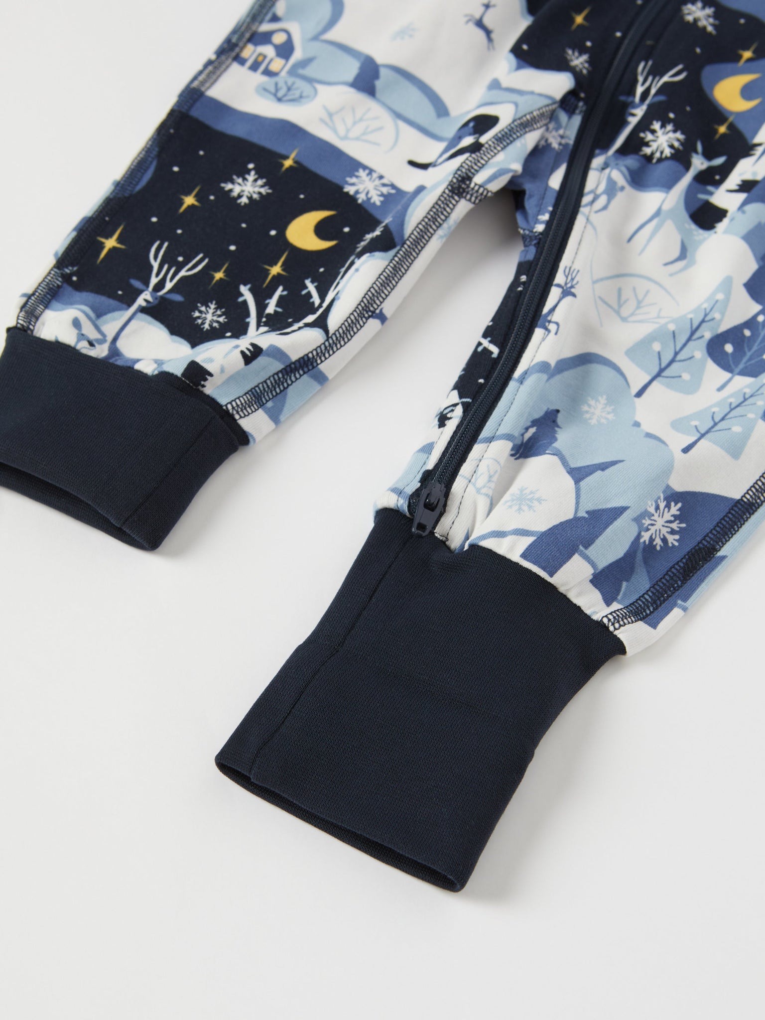 Winter Forest Print Baby Sleepsuit from the Polarn O. Pyret baby collection. Nordic kids clothes made from sustainable sources.