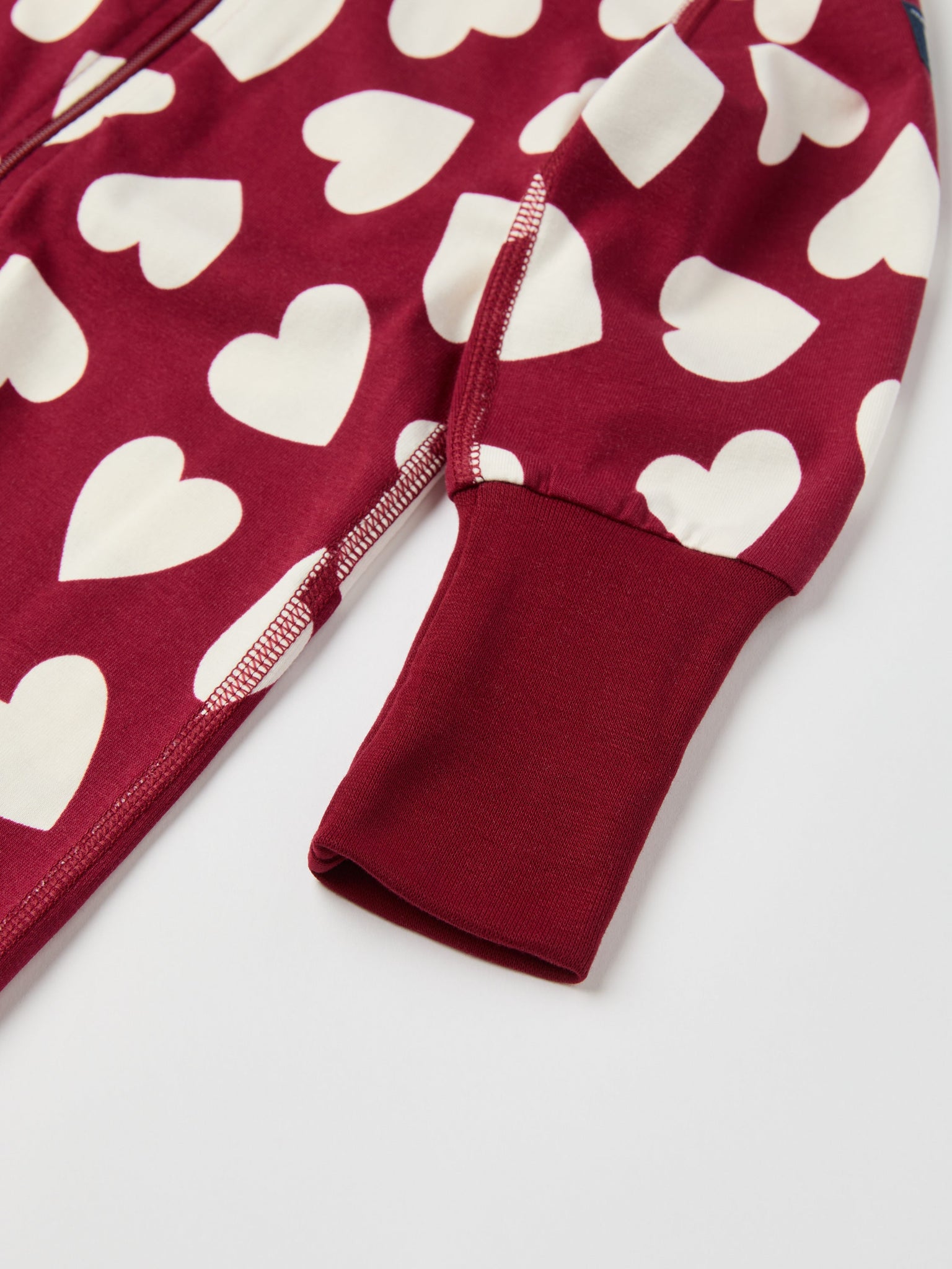 Heart Print Baby Sleepsuit from the Polarn O. Pyret baby collection. Ethically produced kids clothing.