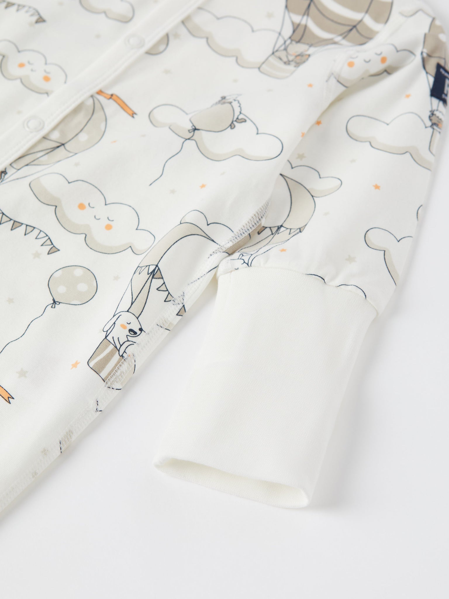 Balloon Print Baby Sleepsuit from the Polarn O. Pyret baby collection. Clothes made using sustainably sourced materials.