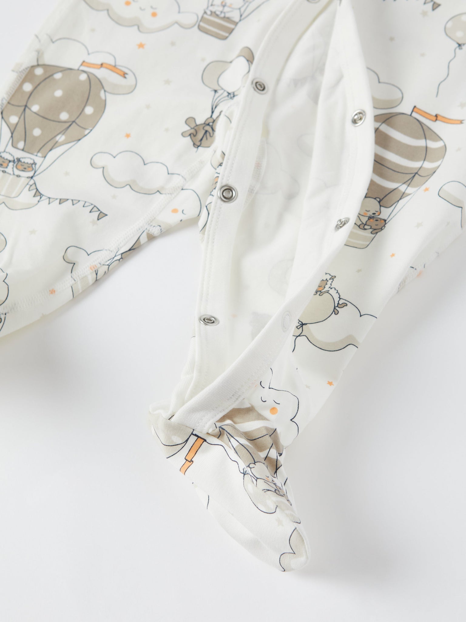 Balloon Print Baby Sleepsuit from the Polarn O. Pyret baby collection. Clothes made using sustainably sourced materials.