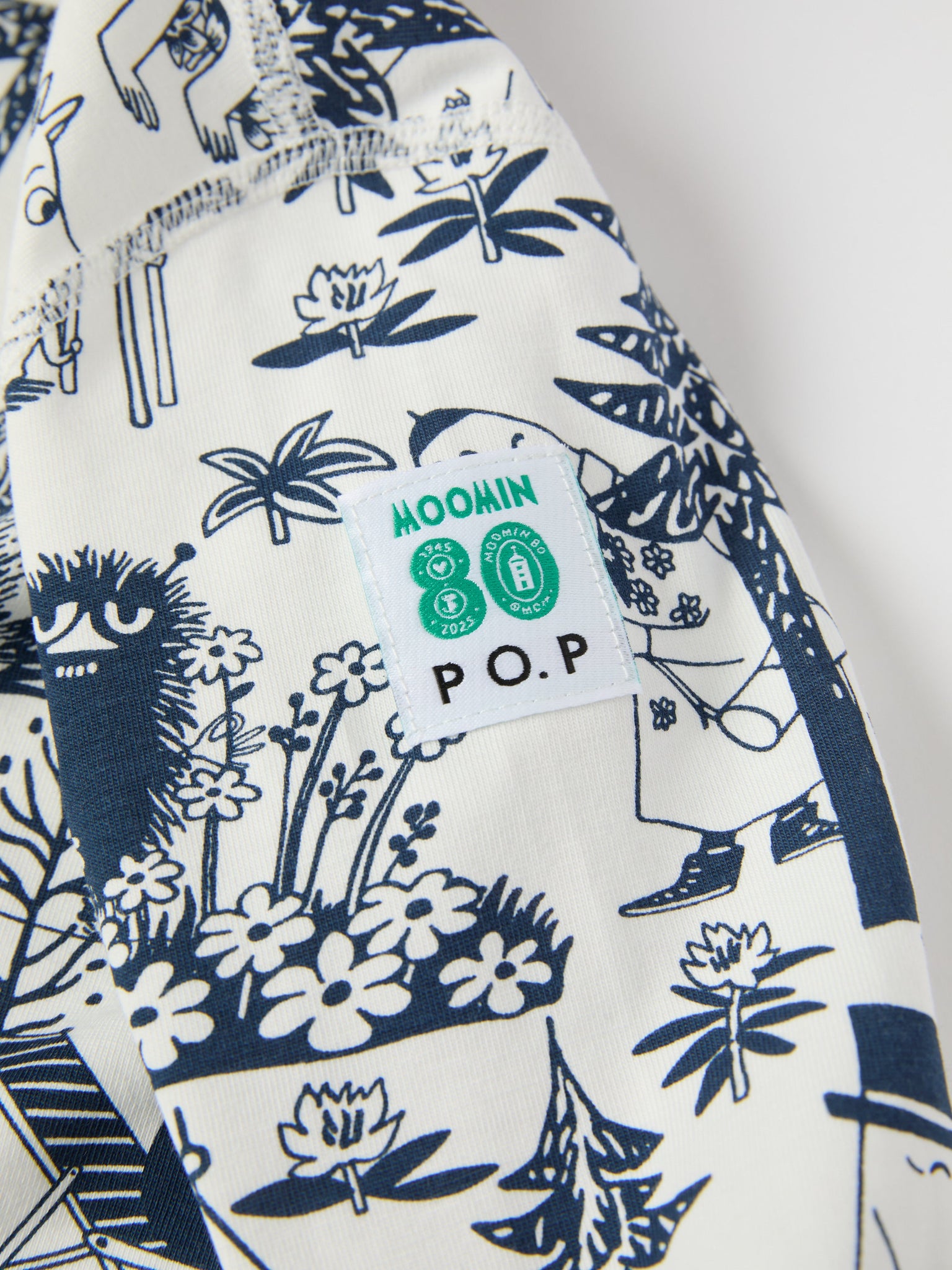 Moomin Print Cotton Baby Sleepsuit from the Polarn O. Pyret baby collection. Clothes made using sustainably sourced materials.