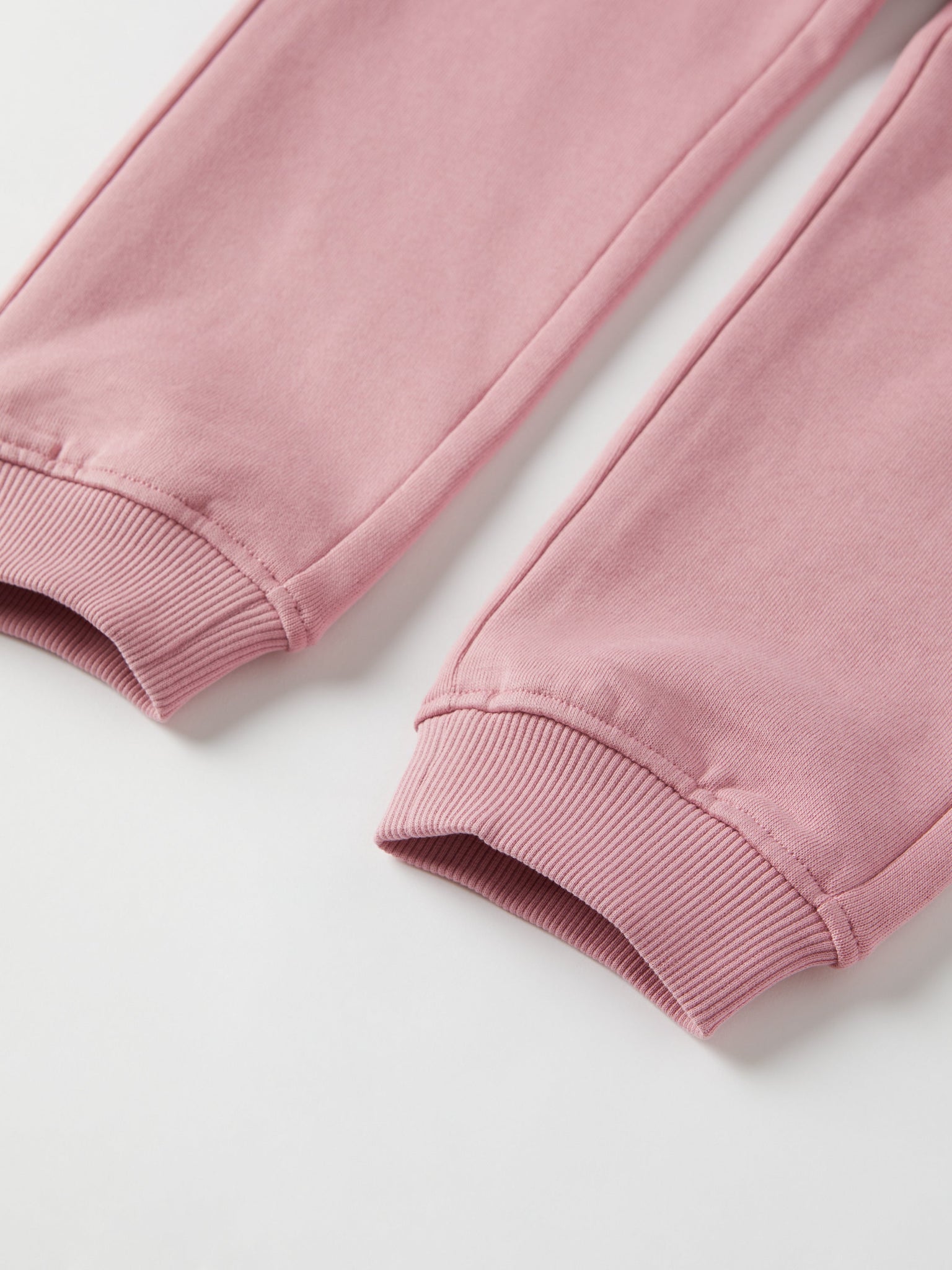 Pink Kids Joggers from Polarn O. Pyret kidswear. Clothes made using sustainably sourced materials.