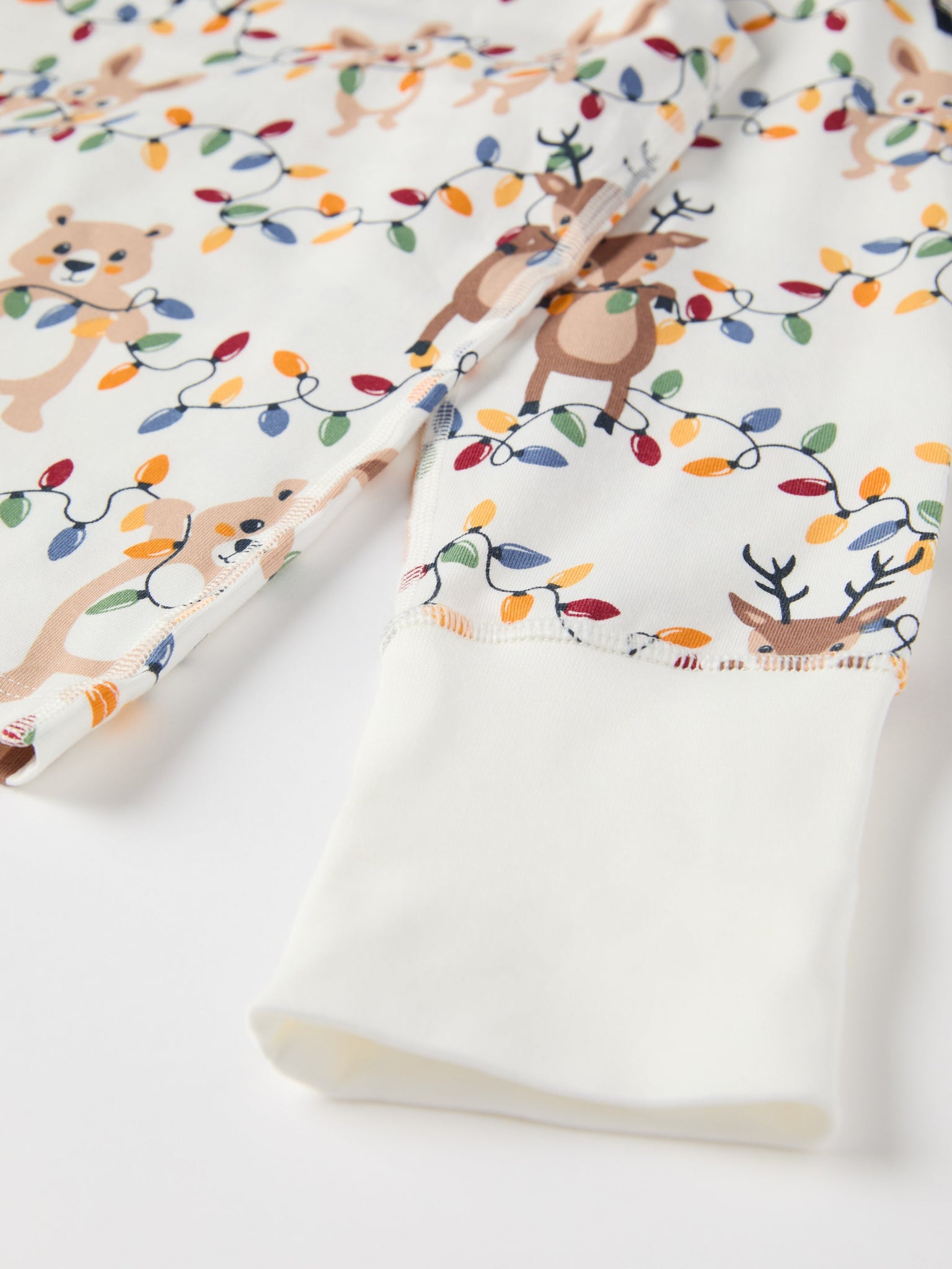 Christmas Lights Kids Pyjamas from the Polarn O. Pyret kidswear collection. Ethically produced kids clothing.