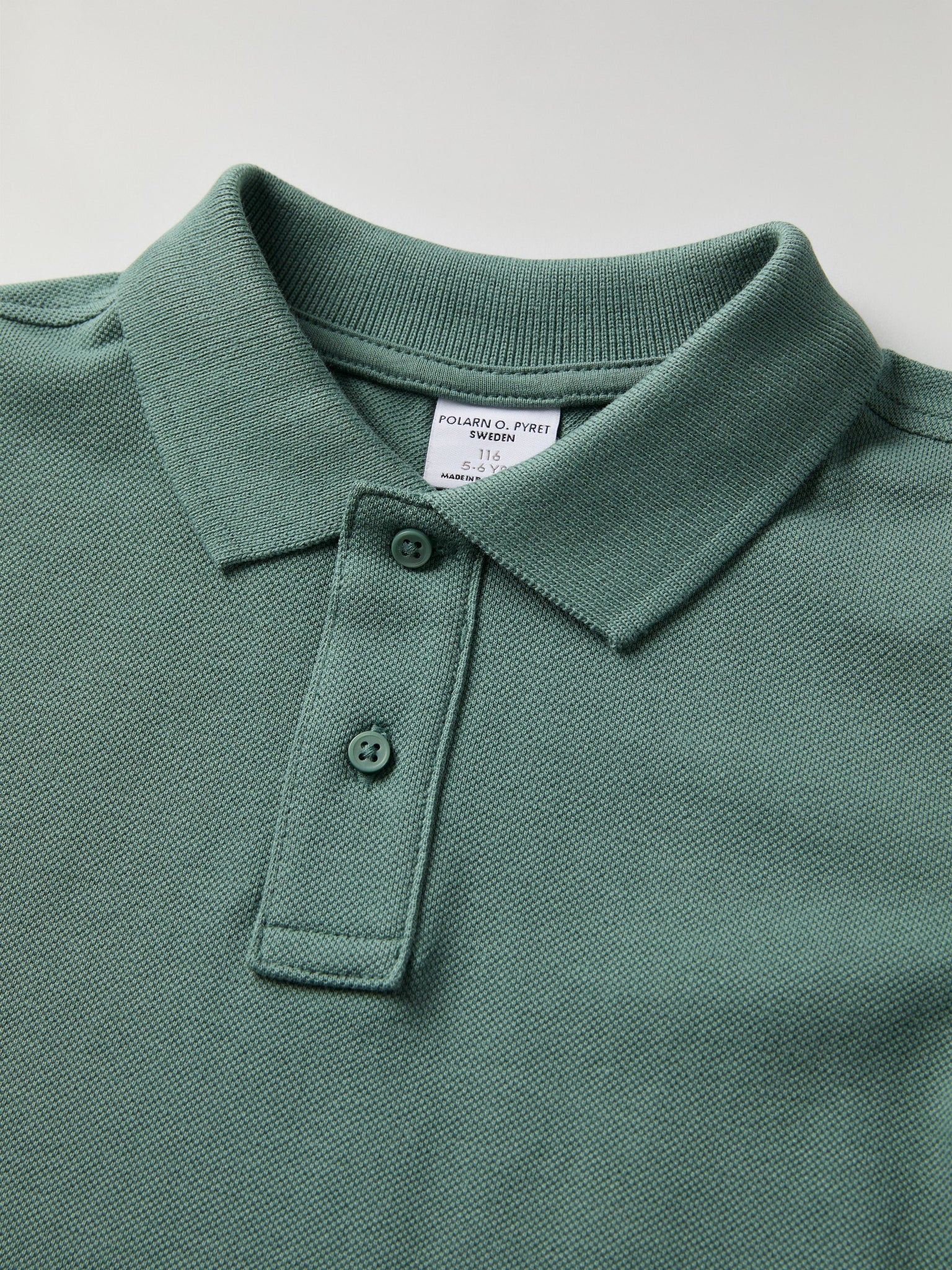 Green Long Sleeve Polo Top from Polarn O. Pyret kidswear. Clothes made using sustainably sourced materials.