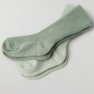 Two Pack Baby Socks in green from the Polarn O. Pyret baby collection. Clothes made using sustainably sourced materials.