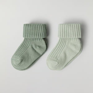 Two Pack Baby Socks in green from the Polarn O. Pyret baby collection. Clothes made using sustainably sourced materials.