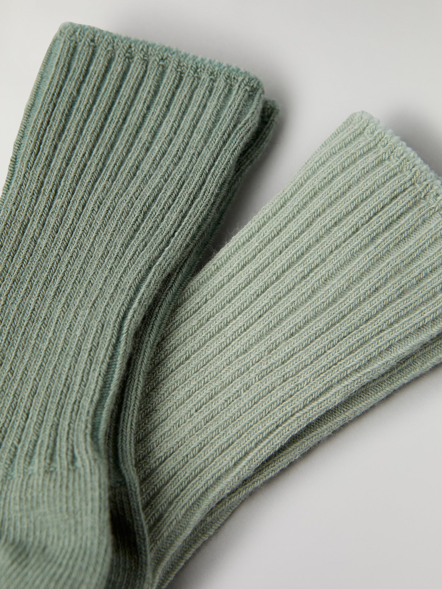 Two Pack Baby Socks in green from the Polarn O. Pyret baby collection. Clothes made using sustainably sourced materials.