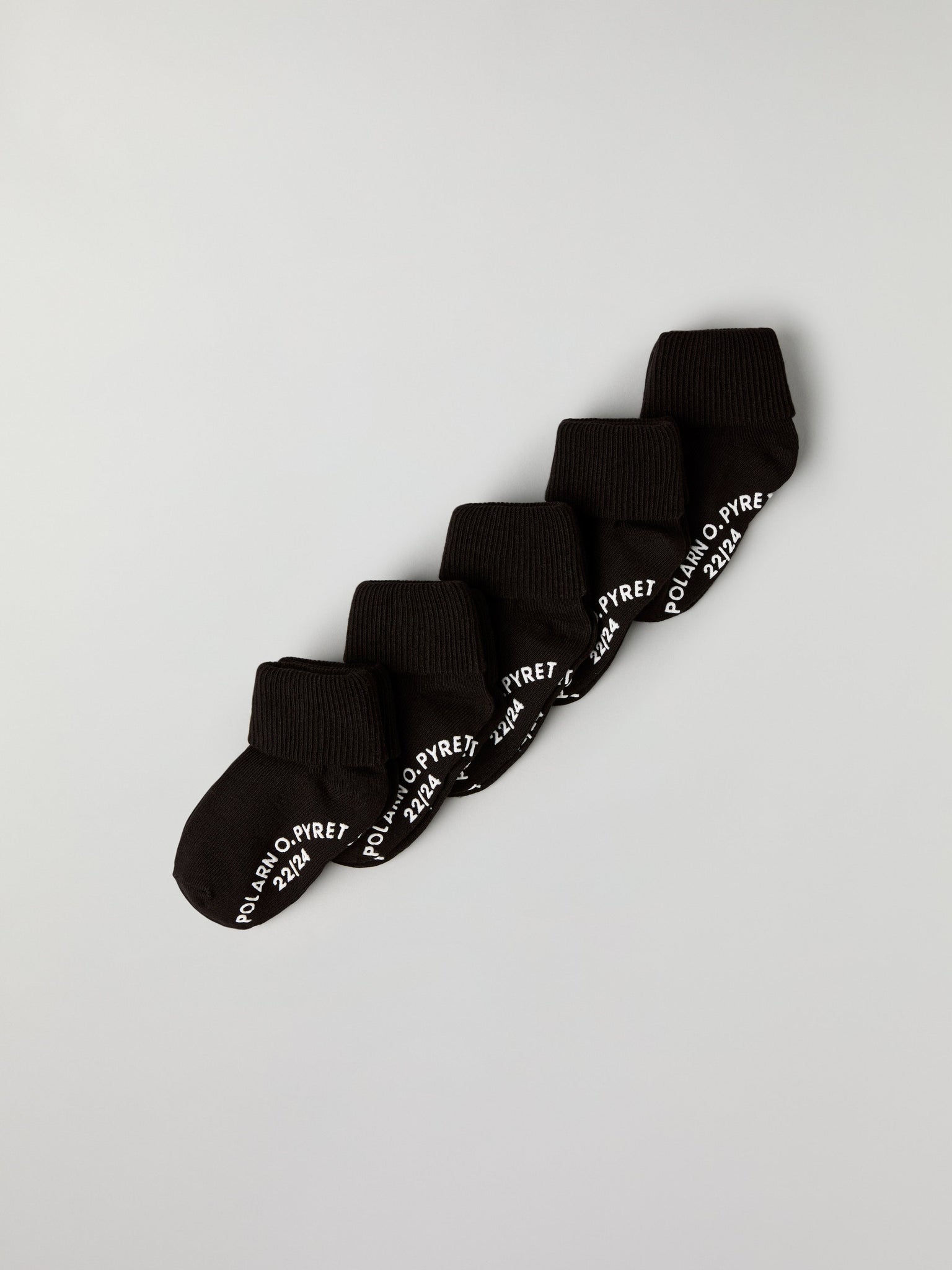 Five Pack Black Kids Socks from Polarn O. Pyret kidswear. Nordic kids clothes made from sustainable sources.