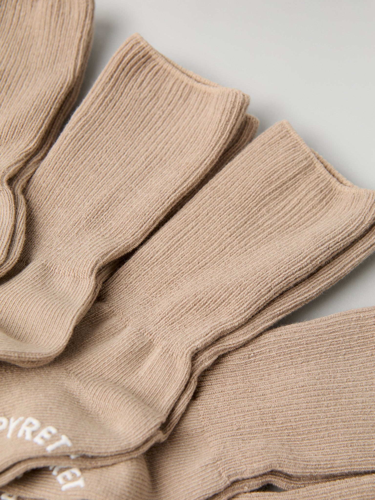 Five Pack Beige Kids Socks from Polarn O. Pyret kidswear. Clothes made using sustainably sourced materials.