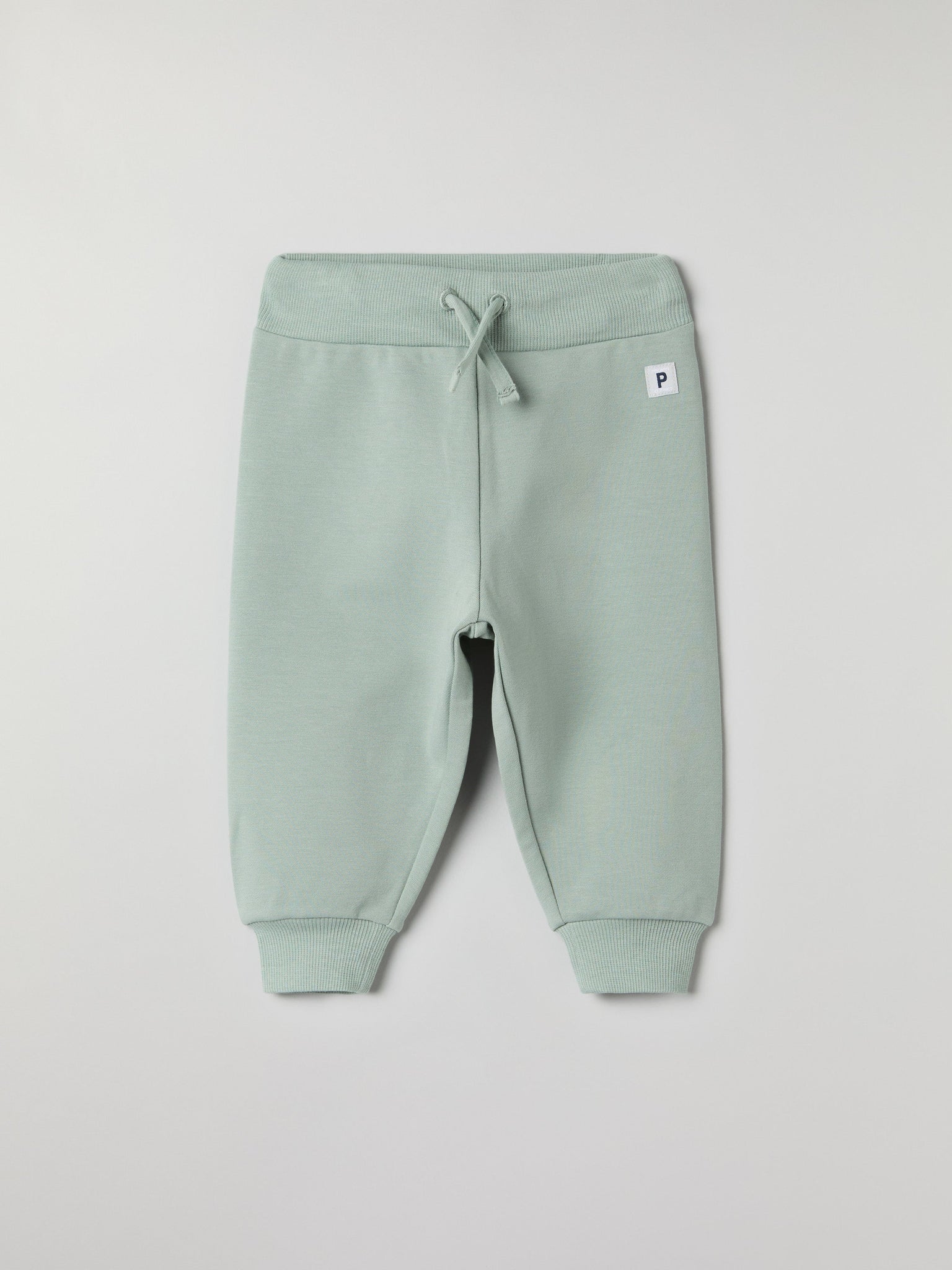 Soft Green Baby Joggers from the Polarn O. Pyret baby collection. Nordic kids clothes made from sustainable sources.