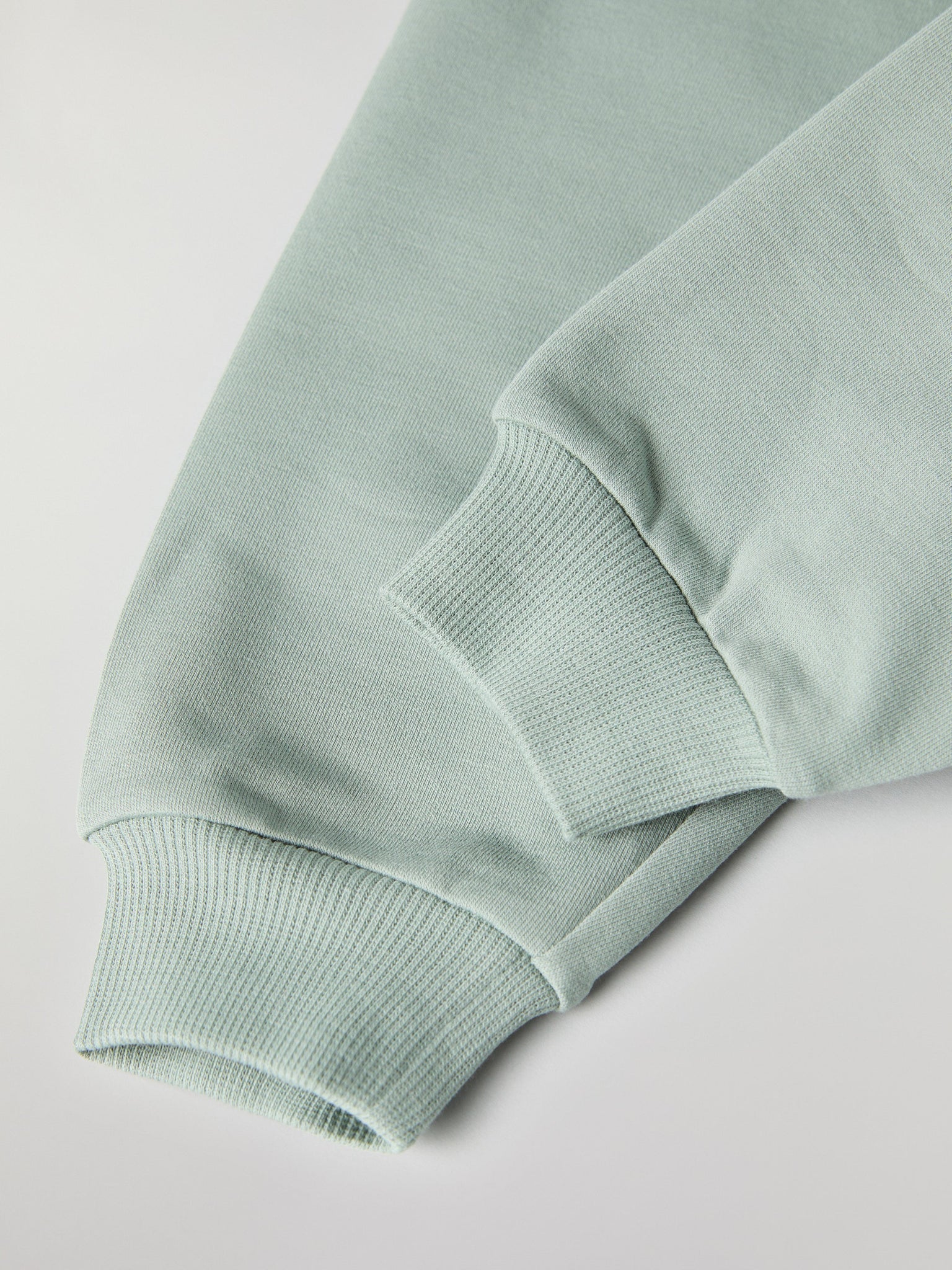 Soft Green Baby Joggers from the Polarn O. Pyret baby collection. Nordic kids clothes made from sustainable sources.