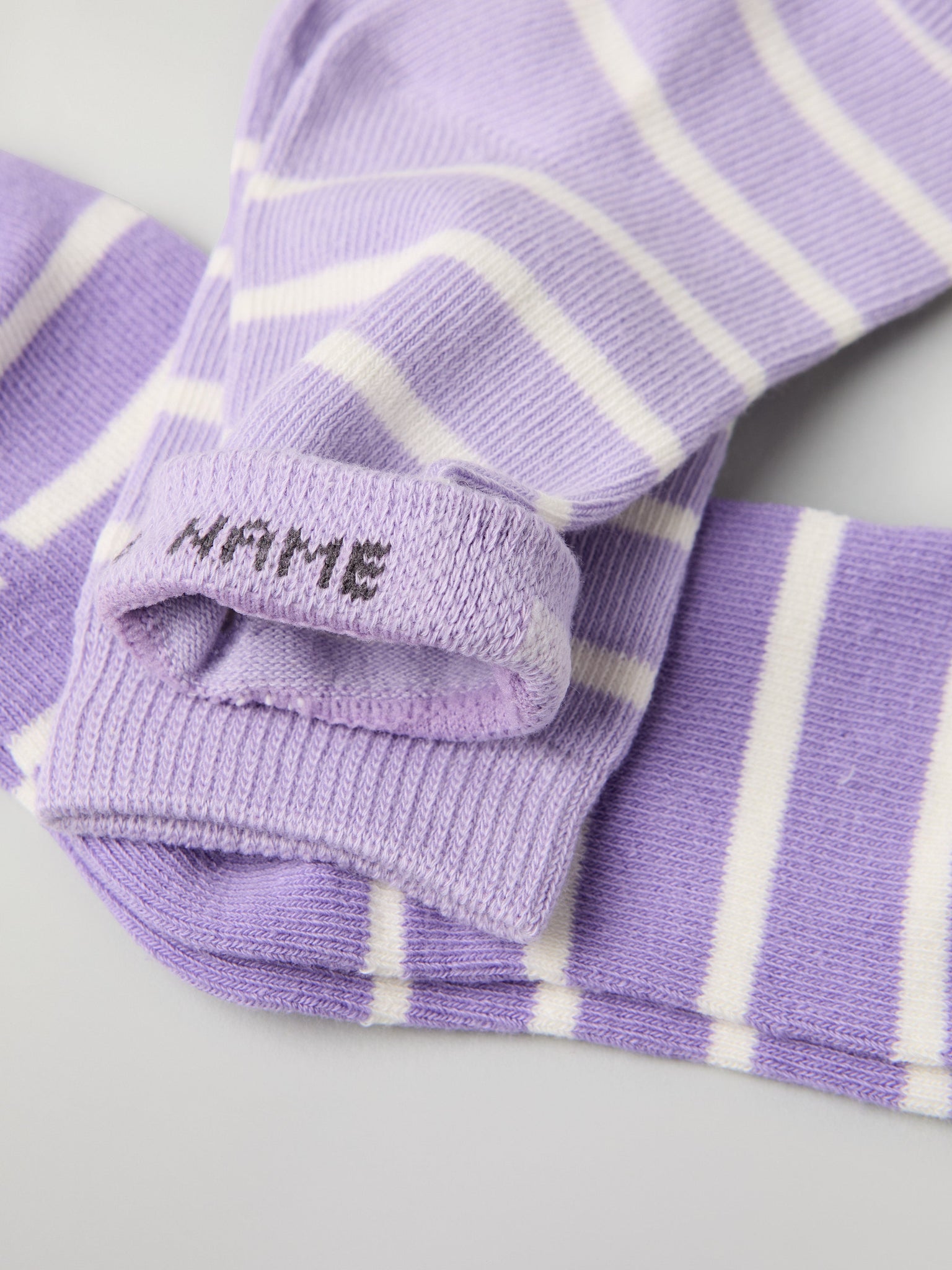 Two Pack Purple Striped Kids Socks from Polarn O. Pyret kidswear. Clothes made using sustainably sourced materials.