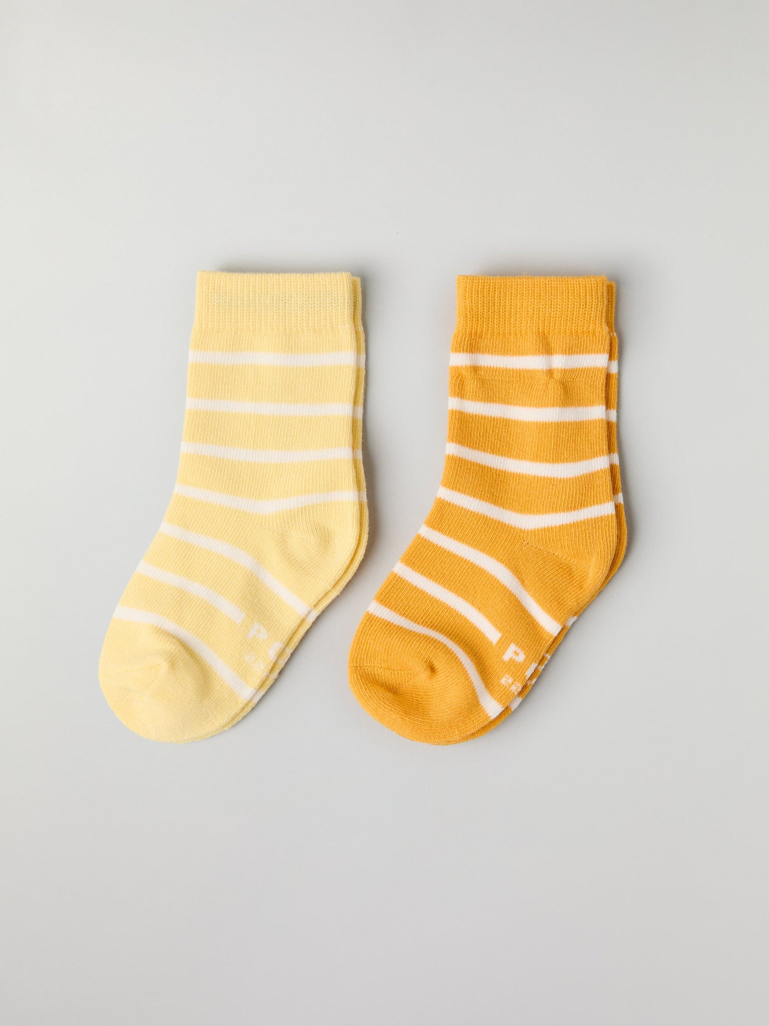 Two Pack Yellow Striped Kids Socks from Polarn O. Pyret kidswear. Nordic kids clothes made from sustainable sources.