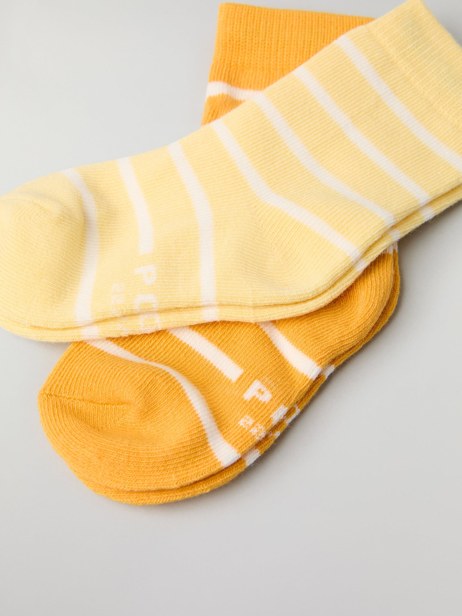 Two Pack Yellow Striped Kids Socks from Polarn O. Pyret kidswear. Nordic kids clothes made from sustainable sources.