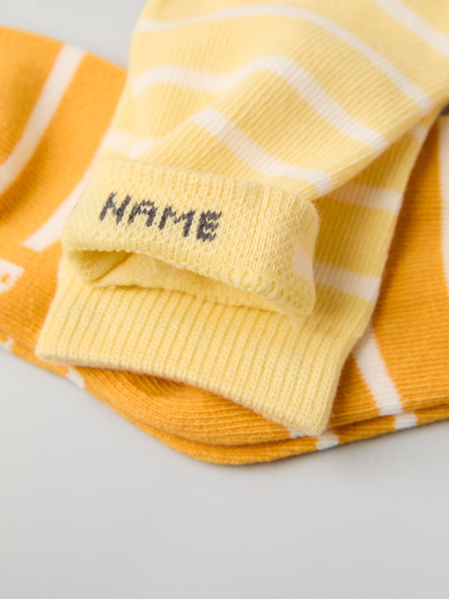 Two Pack Yellow Striped Kids Socks from Polarn O. Pyret kidswear. Nordic kids clothes made from sustainable sources.