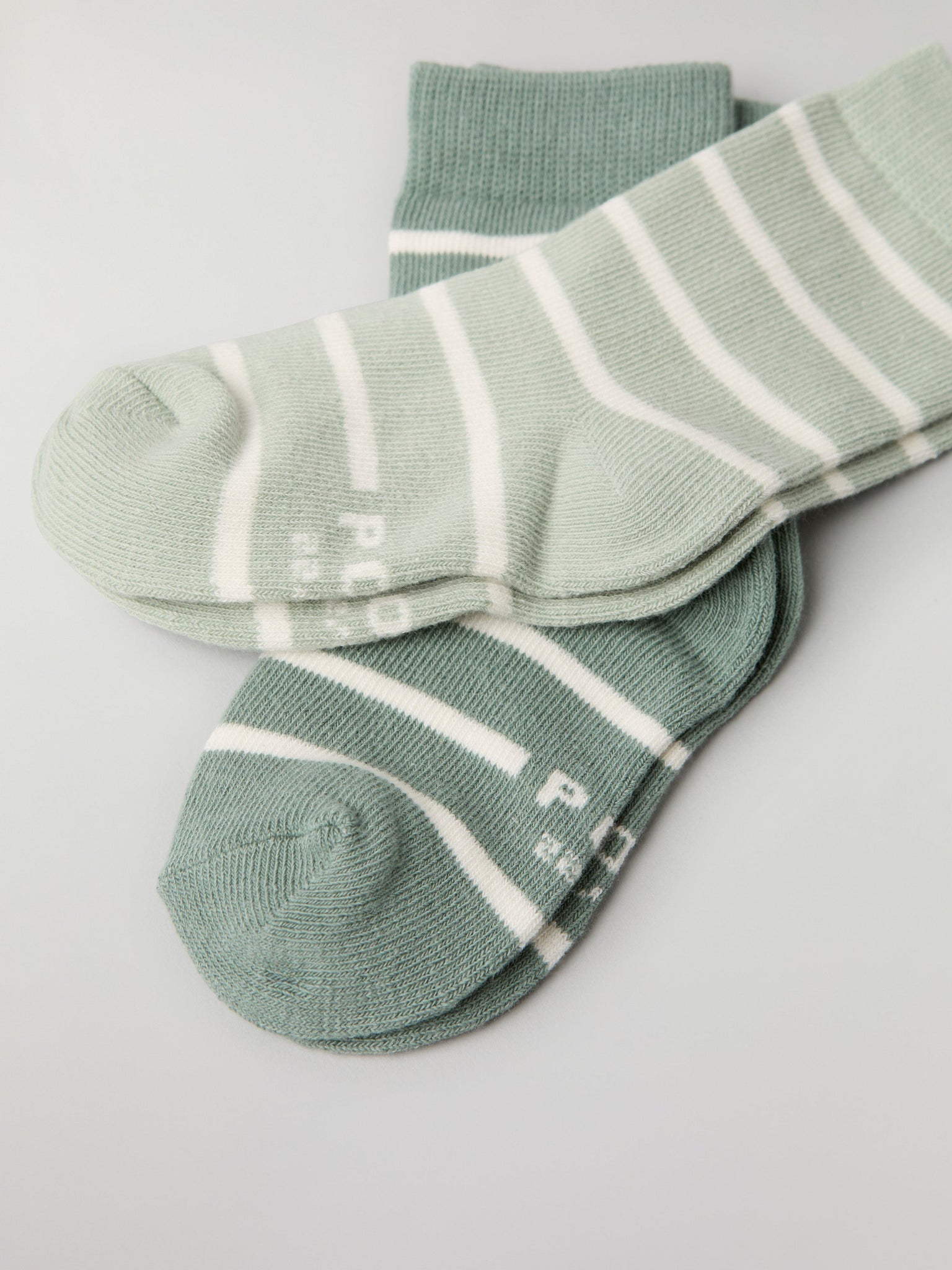 Two Pack Green Striped Kids Socks from Polarn O. Pyret kidswear. Ethically produced kids clothing.