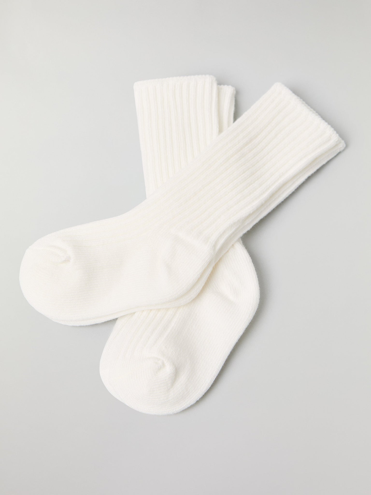 White Two Pack Baby Socks from the Polarn O. Pyret baby collection. Nordic kids clothes made from sustainable sources.