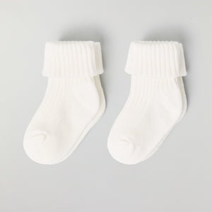 White Two Pack Baby Socks from the Polarn O. Pyret baby collection. Nordic kids clothes made from sustainable sources.