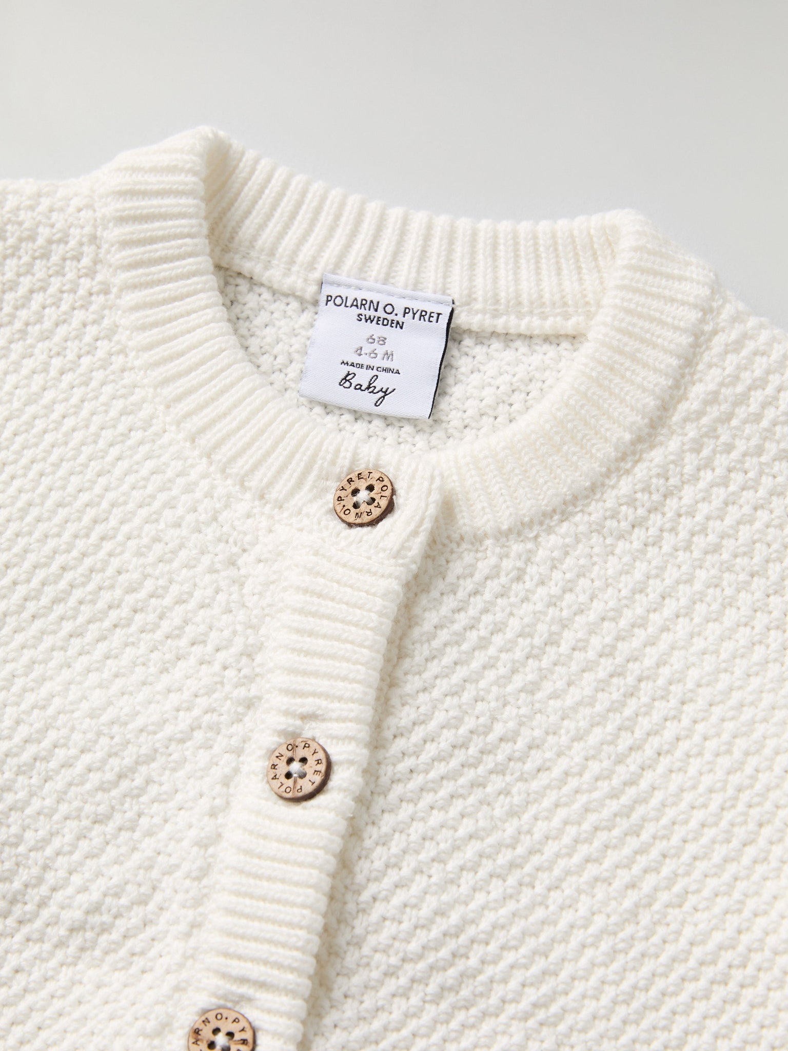 Knitted Organic Cotton Baby Cardigan from the Polarn O. Pyret baby collection. Nordic kids clothes made from sustainable sources.