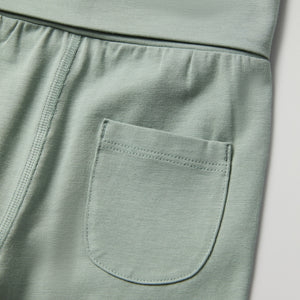 Green Soft Baby Leggings from the Polarn O. Pyret baby collection. Clothes made using sustainably sourced materials.