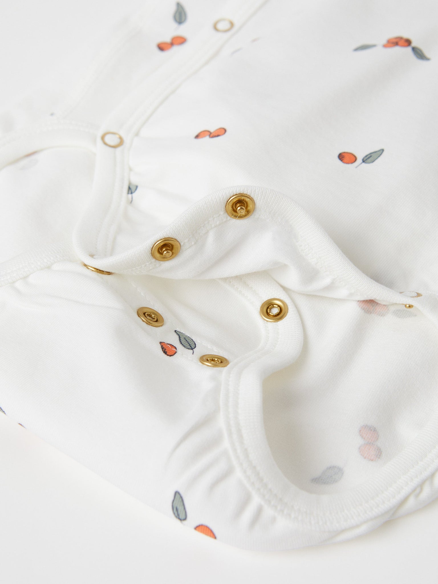 Organic Cotton White Wraparound Babygrow from the Polarn O. Pyret baby collection. Clothes made using sustainably sourced materials.