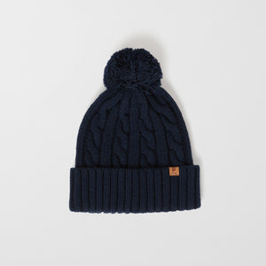 Wool Kids Navy Bobble Hat from the Polarn O. Pyret outerwear collection. Made using ethically sourced materials.